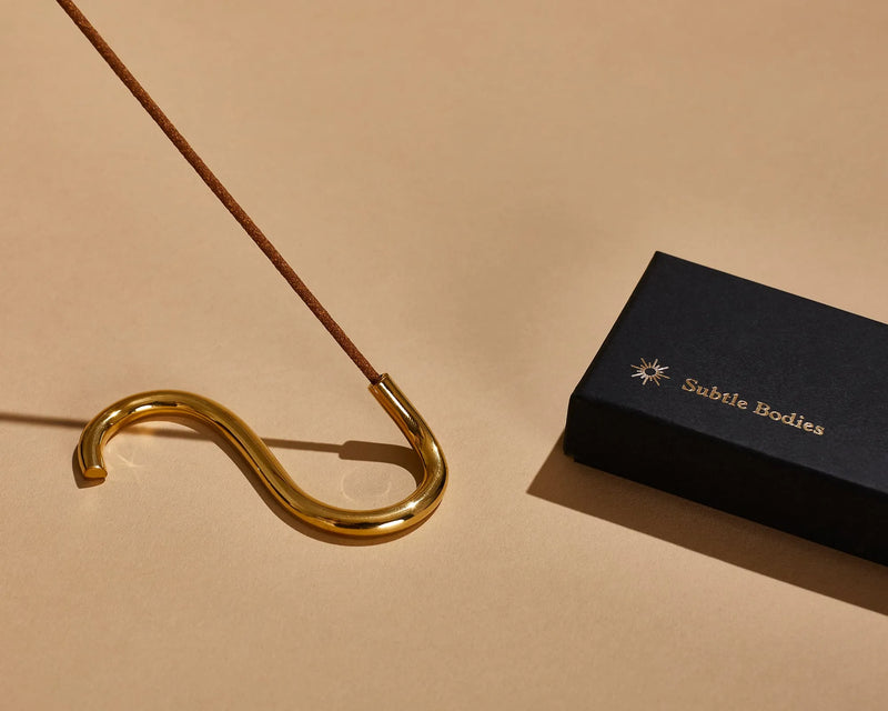 Buy Subtle Bodies Brass Incense Holder (i) S Shape at One Fine Secret Clean Beauty.