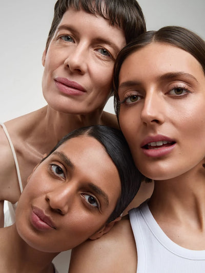 Three women posing closely together. Und Gretel BESTE CCC Cream. One Fine Secret.